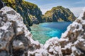 El Nido, Palawan, Philippines. Matinloc island and tapiutan strait framed by limestone sharp rocks in foreground. Bacuit Royalty Free Stock Photo