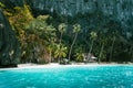 El Nido, Palawan, Philippines. Secluded tropical hut on Pinagbuyutan Island. Amazing white sand beach,turquoise blue Royalty Free Stock Photo