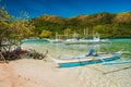 El Nido, Palawan, Philippines. Snake island location with traditional boats moored on hopping trip Royalty Free Stock Photo