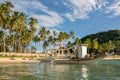 El Nido Palawan Philippines: Tropical landscape with boat, blue and crystal clear sea water, white sand and island Royalty Free Stock Photo