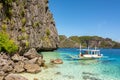 El Nido Palawan Philippines: Tropical landscape with boat, blue and crystal clear sea water, white sand and island Royalty Free Stock Photo