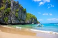 El Nido, the Philippines - 20 Nov 2018: Tourist boat on seashore of idyllic tropical island with sand beach and blue sea