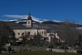 El Paular monastery with intense blue sky and animals grazing, Lozoya Valley, Madrid, Spain Royalty Free Stock Photo