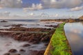 El Pris pool wall with green moss, close to Atlantic ocean with volcanic rocks Royalty Free Stock Photo