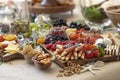 Elaborate charcuterie table set up with meats, bread, cheese, nuts, and fruit Royalty Free Stock Photo