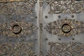 Elaborate detail in scrollwork of impressive doors