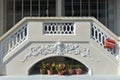 Elaborate fascia board and decorative plaster motif design on a conserved single-storey terrace house along East Coast Road