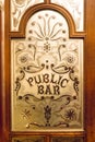 Elaborate glass door of a London pub