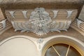 Elaborate stucco ornament above an house entrance, old town munich schwabing, historic building