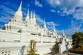 Elaborated white Buddhist Pagoda at Wat Asokaram Temple in Thailand