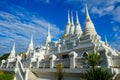 Elaborated white Buddhist Pagoda at Wat Asokaram Temple in Thailand