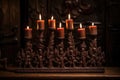 elaborately carved wooden kinara holding seven candles