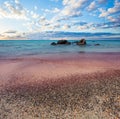 Elafonissi, famous greek beach on Crete. Sky clouds, blue sea and pink sand in Greece