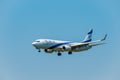 Elal Israel airlines airplane preparing for landing at day time in international airport