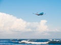 Elal Israel Airlines Boeing 737-800 flying by in white clouds and blue sky, landing at Larnaca International Airport