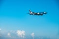 Elal Israel Airlines Boeing 737-800 flying by in white clouds and blue sky, landing at Larnaca International Airport