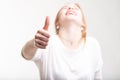 Elated excited woman giving a thumbs up Royalty Free Stock Photo