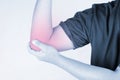 Elbow injury in humans .elbow pain,joint pains people medical, mono tone highlight at elbow Royalty Free Stock Photo