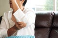 Elbow pain/injury, old woman suffering from elbow pain, health problem concept