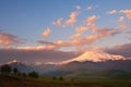 Elbrus mount with pink clouds at sunrise. View from Gil-Su valley in North Caucasus, Russia Royalty Free Stock Photo