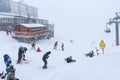 Elbrus, Russian Federation - January 20, 2024: People snowboard and ski during heavy snowfall on Elbrus in winter Royalty Free Stock Photo