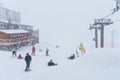 Elbrus, Russian Federation - January 20, 2024: People snowboard and ski during heavy snowfall on Elbrus in winter Royalty Free Stock Photo