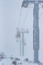 Elbrus, Russian Federation - January 20, 2024: Ski lifts on Elbrus during heavy snowfall Royalty Free Stock Photo