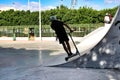 Children practicing skateboard on a skate court