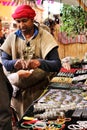 Arab merchant selling jewelry at a market stall