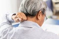 Elder back neck pain using hand to massage