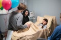 An elder brother visiting his little sister at the hospital Royalty Free Stock Photo