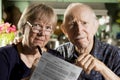 Elder Couple with Bills Royalty Free Stock Photo