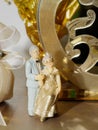 Elder couple statue golden wedding