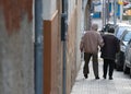 An elder couple walk downtown Palma de Mallorca