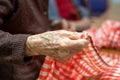 Elder hands, folding napkins