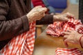 Elder hands, folding napkins