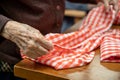 Elder hands, folding napkins