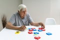 Elder Man Playing Jigsaw Puzzle Royalty Free Stock Photo