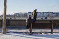 Elder man sit alone on bench at Rheinuferpromenade along riverside of Rhine river in DÃÂ¼sseldorf, Germany.