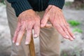 Elder man take care of plants at garden of nursing home for retirement Royalty Free Stock Photo