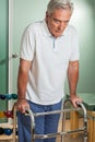 ELder man using a walker Royalty Free Stock Photo