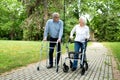 Elder man and a elder woman strolling in the park