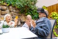 Elder man using virtual reality goggles in a nursing home