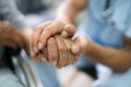 Elder Patient Helping Nurse Hand