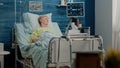 Elder patient with sickness laying in hospital bed Royalty Free Stock Photo