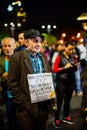 Elder protester with message, Bucharest, Romania