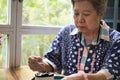 Elder senoir eating blueberry cheese cake at cafe. asian elderly