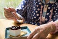 Elder senoir eating blueberry cheese cake at cafe. asian elderly