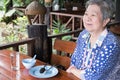 Elder senoir waiting for food. happy elderly woman sitting at re