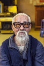 Elder vietnamese hipster having a very long white beard